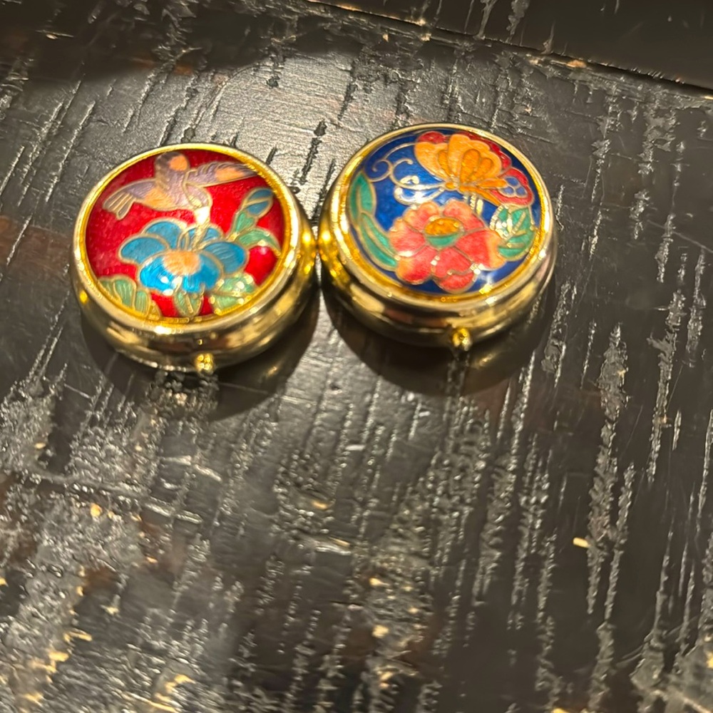 Two small pill containers